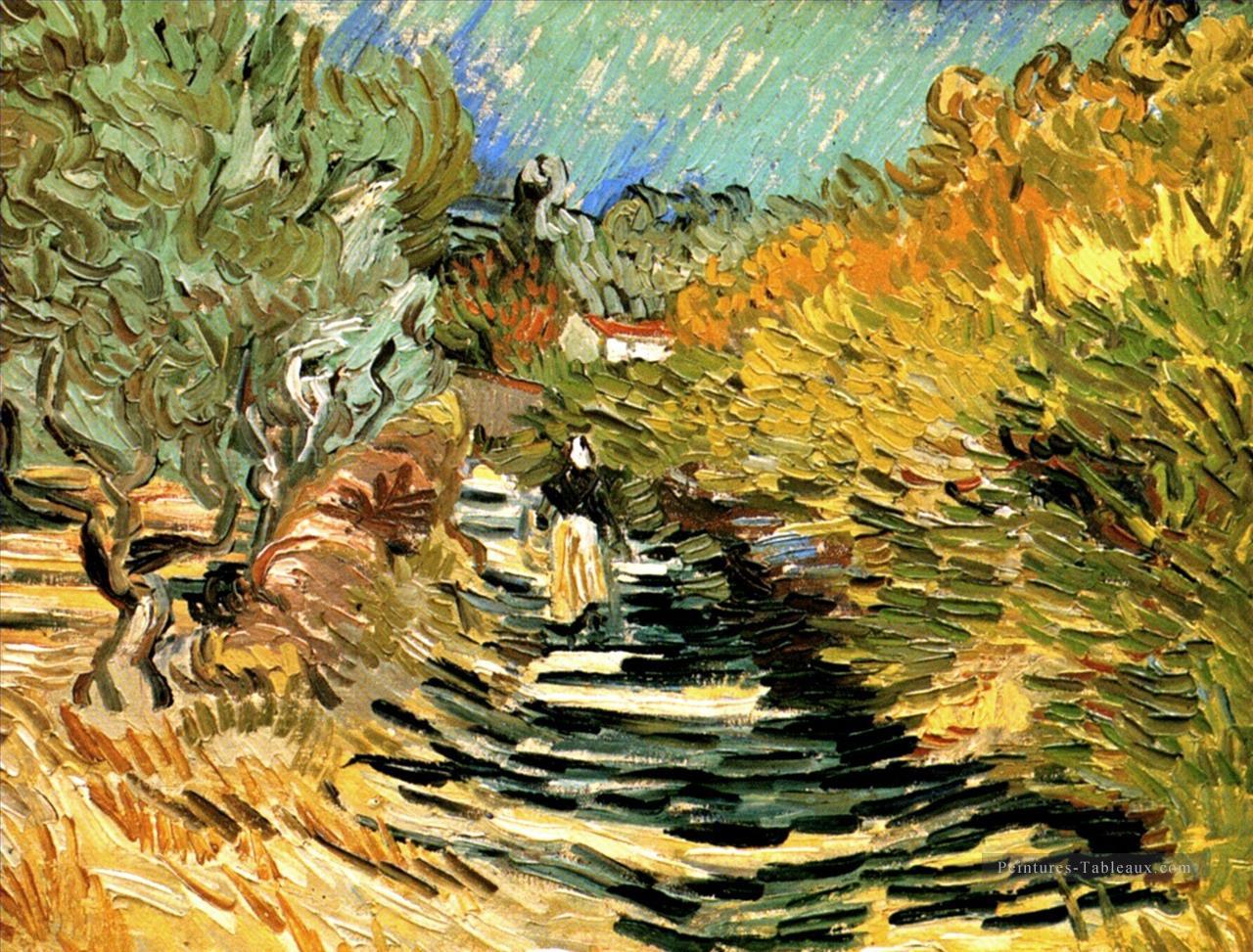 Une route à St Rémy avec des figures féminines Vincent van Gogh Peintures à l'huile